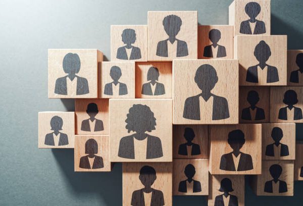 Top view of various wood cubes with people icons.