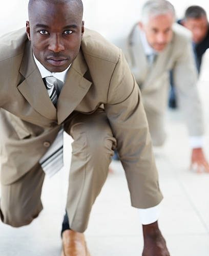 Business colleagues lined up getting ready for race